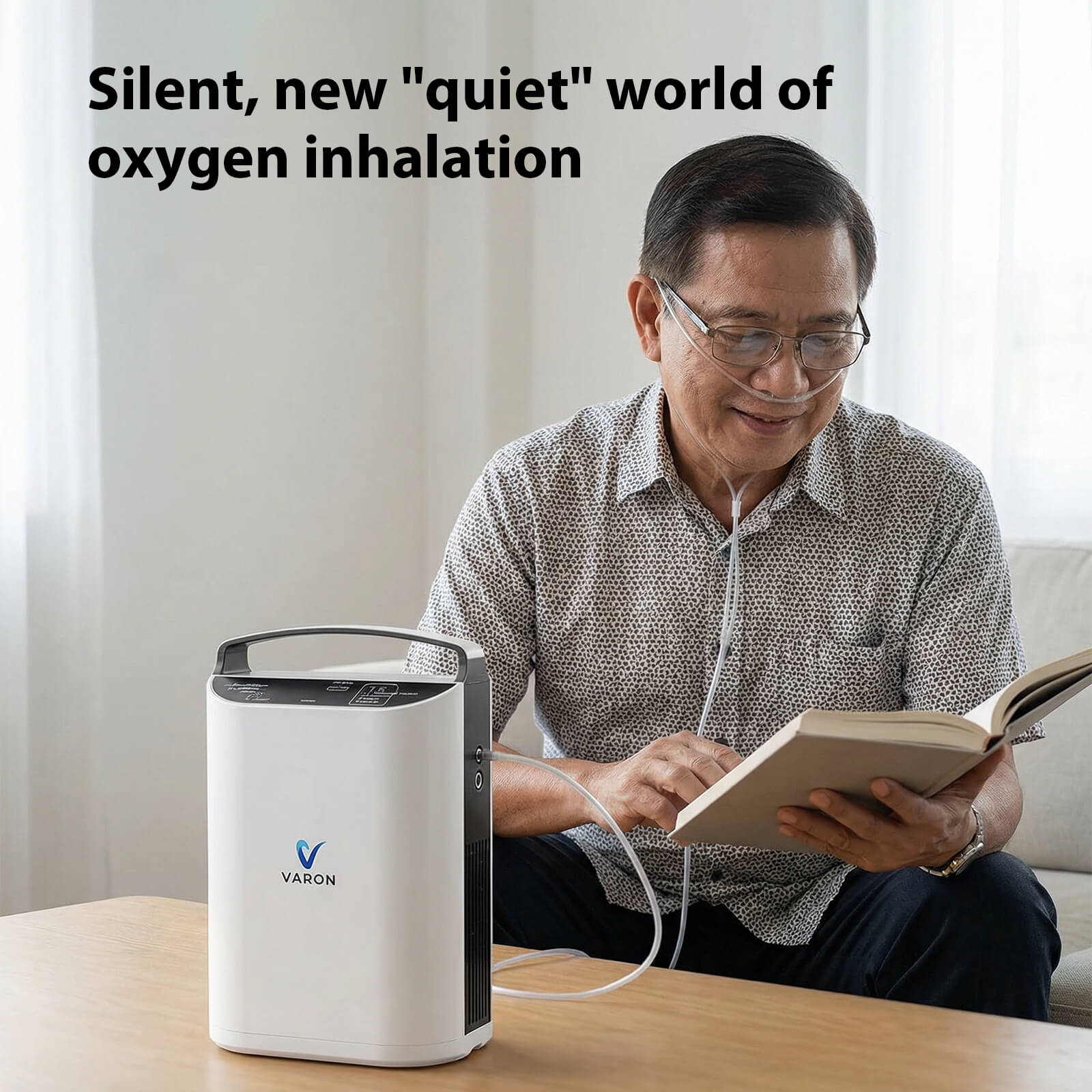 Elderly man sitting on a couch and reading while using his VP-1 portable oxygen concentrator.